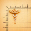 Брошь "Кадуцей+ Фонендоскоп"  Au 585 с локальным родированием